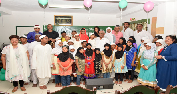 President David Granger, Minister of Social Cohesion Ms. Amna Ally along with members of the Guyana United Sadr Islamic Anjuman’s Board as they took time to take a photograph with the children under the care of the two orphanages
