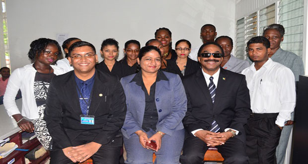 Attorney-General and Minister of Legal Affairs, Mr Basil Williams (seated right); with Registrar of Deeds Registry, Ms Azeena Baksh and Assistant Registrar, Ms Reza Manraj and other staff of the Berbice Deeds Registry