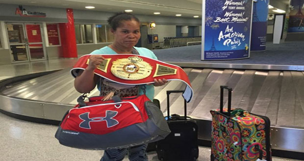 Guyana’s Gwendolyn O’Neil poses with her UBF heavyweight title belt.
