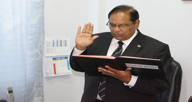 Prime Minister Moses Nagamootoo taking the oath as President. President David Granger left Guyana yesterday to attend the CARICOM Heads of Government Conference in Barbados.