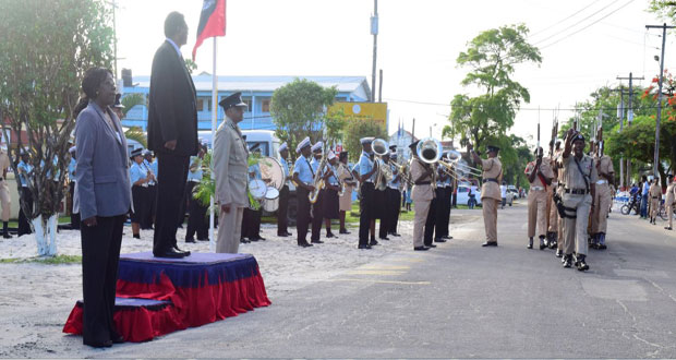 Public Security Minister Ramjattan takes the salute from parade commander, Assistant Commissioner Clifton Hicken