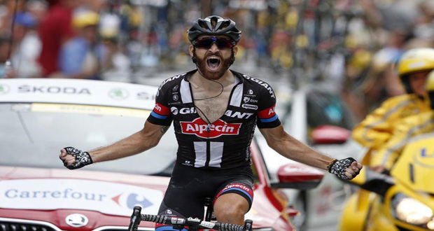 Giant Alpecin rider, Simon Geschke of Germany, celebrates as he crosses the finish line to win stage 17.