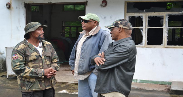James George, Toshao of Moco Moco in discussions with the Minister of Governance, Raphael Trotman and Advisor on Sustainable Development, Mr. Clayton Hall at the Moco Moco Hydropower Station in Region 9 on Friday.