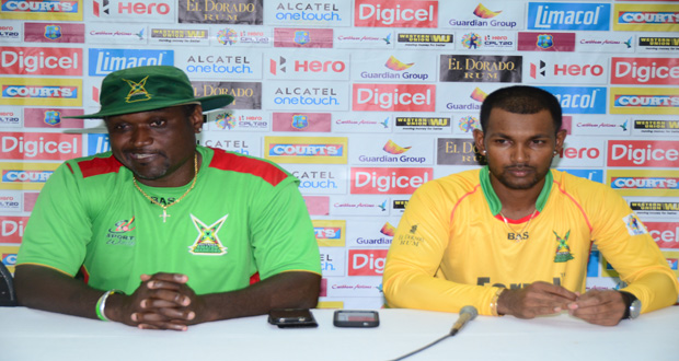 Amazon Warriors Coach Carl Hooper (left) makes a point during the post match press conference. Captain Denesh Ramdin (right) looks on (Adrian Narine Photo)