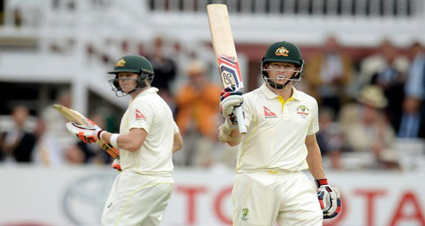 Australia’s Chris Rogers celebrates scoring 150 runs as Steve Smith applauds.