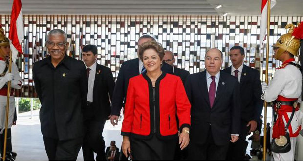 President David Granger with Brazilian President Dilma Rousseff at Cúpula MERCOSUR Summit 2015 in Brazil on Thursday. There is a move to return Mercosur to 'its roots', reach an agreement on some of the original fundamentals, eliminate restrictions to inter-trade and strongly promote the trade accord with the European Union.