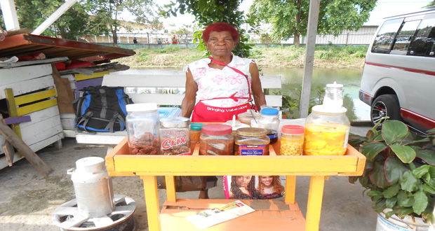 74-year-old Patricia McGarrel, at her ‘stand’, where she sells plantain chips, cassava balls, juice, polouri, tamarind balls, tamarind syrup, pickle mango, mango syrup and ‘chicken foot’, among other things