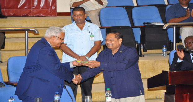 Minister Holder receives a token of appreciation from Prime Minister Nagamootoo for his efforts at making the conference a success (Photos by Delano Williams)