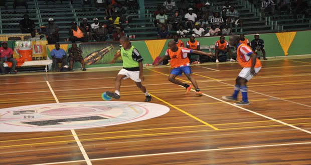 Part of the action in the Petra Organisation/GT Beer Futsal Tournament at the Cliff Anderson Sports Hall.
