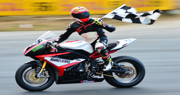 : Matthew Vieira waves the chequered flag after winning one of his two Superbike races (Samuel Maughn photos)