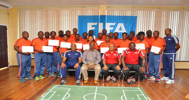 Graduates of the Fédération Internationale de Football Association (FIFA) Referees Assistance Programme (RAP) show off their certificates, while posing with instructors Peter Prendergast and Allan Brown, GRFU’s Alfred King and head of referees Stanley Lancaster.