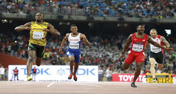 Usain Bolt of Jamaica (L) crosses the finish line ahead of Justin Gatlin (2nd R) from the U.S., Zharnel Hughes of Britain (2nd L) and Ramil Guliyev of Turkey in the men's 200m final during the 15th IAAF World Championships at the National Stadium in Beijing, China, yesterday. (Reuters/Lucy Nicholson)