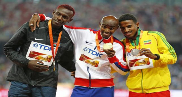 (L-R) Caleb Mwangangi Ndiku of Kenya (silver), Mo Farah of Britain (gold), and Hagos Gebrhiwet of Ethiopia (bronze) pose on the podium after the men's 5 000-metre event during the 15th IAAF World Championships at the National Stadium in Beijing. (Reuters/Damir Sagolj)