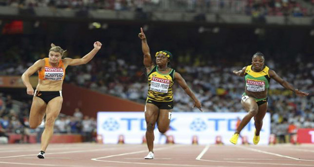 Shelly-Ann Fraser-Pryce of Jamaica (C) celebrates winning the women's 100 metres final ahead of Dafne Schippers of Netherlands (L) who finished second and Veronica Campbell-Brown of Jamaica during the 15th IAAF World Championships at the National Stadium in Beijing, China. (Reuters/Lucy Nicholson)