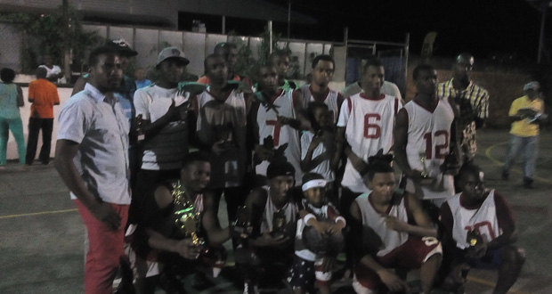 Under-23 champions Half Mile Bulls pose with their spoils after defeating
Amelia’s Ward Jets.