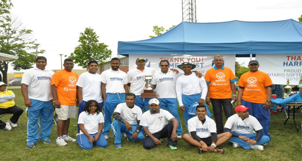 The victorious Caribbean Sensation pose with the winning trophy with some executive members of the OSCL