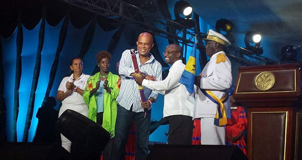 Haiti’s President Michel Martelly (third left) handing over the CARIFESTA baton to Barbados’ Minister of Culture, Stephen Lashley at the closing ceremony (Photo courtesy CARIFESTA Website)