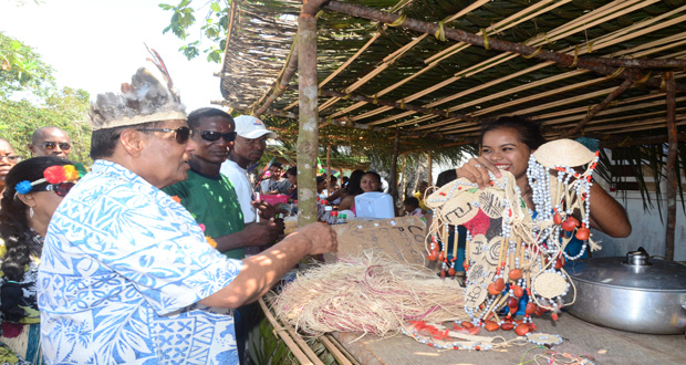 Acting President of Guyana, Prime Minister Moses Nagamootoo, interacting with villagers
