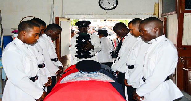 Police ranks pay their last respects to a fallen comrade
