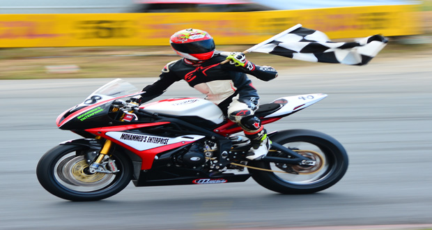Matthew Vieira displays his chequered flag at the recent GMR&SC race of Champions. (Photo by Samuel Maughn)