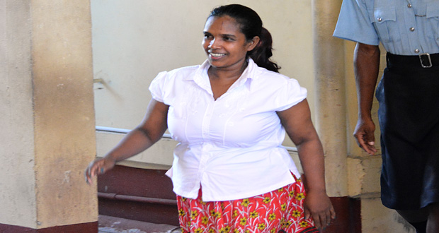 A smiling Gwendolyn Persaud leaves the court after being remanded over her husband’s murder.