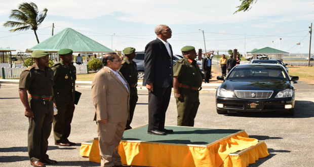 President David Granger taking the salute at GDF on Thursday. Also in photo are: Prime Minister, Moses Nagamootoo (left) and GDF Chief-of-Staff, Mark Phillips(right) (Office of the Prime Minister photo)