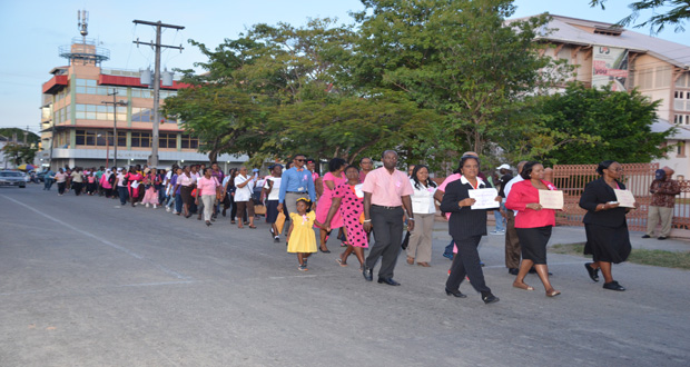 On the move: The symbolic ‘cancer walk’  from the St George’s Cathedral to the Public Buildings (Photos by Delano Williams)