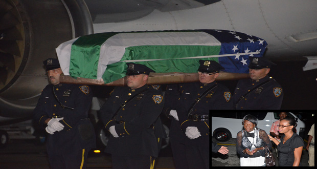 NYPD officers escort the body of their slain colleague,
Randolph Holder off the tarmac of the Cheddi Jagan
Airport Thursday night. (Inset is the dead cop's
grandmother Elizabeth Lovell and another relative
(Delano Williams photo)