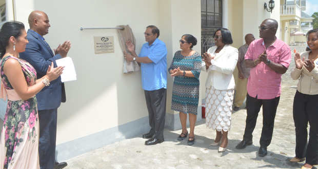 Prime Minister Moses Nagamootoo unveils the plaque to open Demerara Paradise. At left is Dr. Vivakeanand Bridgemohan and his wife.
