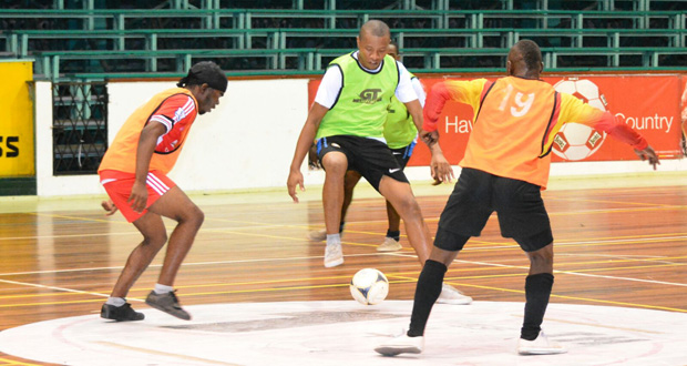 Part of the opening night’s action in the Banks Beer Inter-Corporation Futsal tournament. (Samuel Maughn photo)