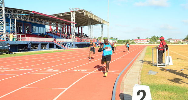 Guyana’s Olympian Winston George crosses the finish line early this week.