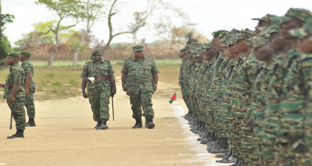 Guyana Defence Force Chief of Staff, Brigadier General Mark Phillips inspects the new soldiers at the passing out ceremony at the Colonel John Clarke Military School at Tacama