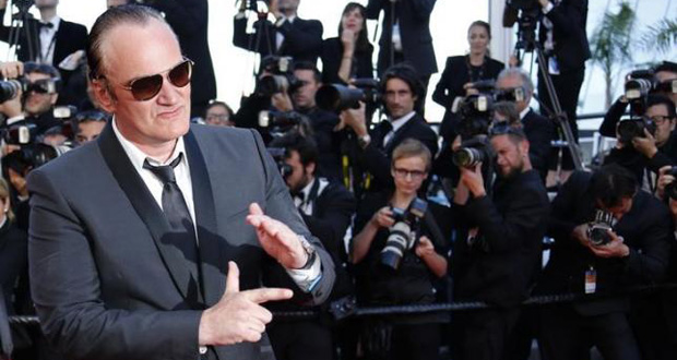 Director Quentin Tarantino poses on the red carpet as he arrives at the closing ceremony of the 67th Cannes Film Festival in Cannes May 24, 2014.