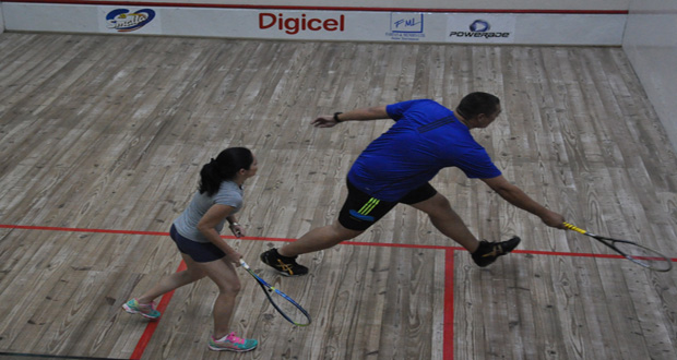 David Fernandes stretches for a return against Suzie DeAbreu.