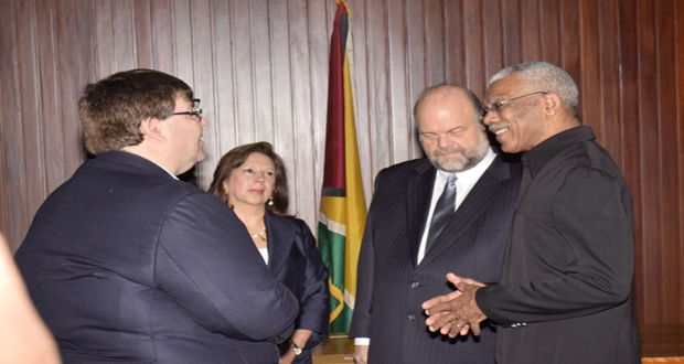 H.E. President David Granger shares a light moment with U.S. Ambassador to Guyana Perry Holloway, his wife Rosaura, and U.S. Chargé d'Affaires Bryan Hunt at the Ministry of the Presidency