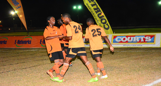Slingerz FC’s Dwayne St Kitts, Julian Wade (#24) and Dexroy Adams (#25) after another goal celebration during their 5-0 win over GFC on Wednesday at the GDF ground (Samuel Maughn photo)