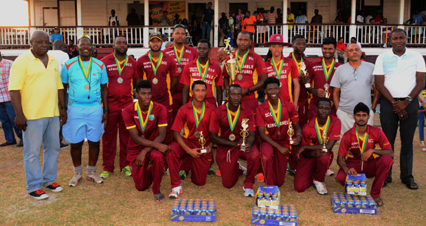 The 2015 Carib Beer T20 Champions, Demerara Cricket Club (DCC), pose with their accolades after sinking GCC in the final yesterday at the DCC Ground. (Adrian Narine Photo)