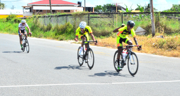 Team Coco’s Raynauth `Obeahman’ Jeffrey (right) celebrates winning the third stage of the NSC `Tour of Guyana’ Five-Stage road race, yesterday.