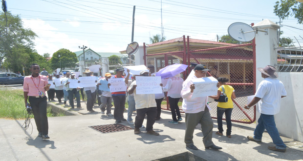 General Secretary of the PPP Clement Rohee leading supporters during a picketing exercise outside of GECOM’s office on Thursday