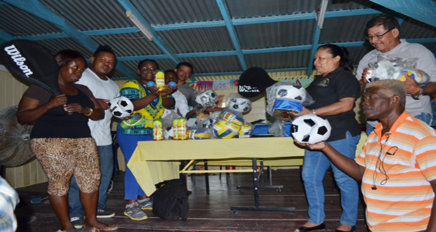 Minister of Indigenous Peoples’ Affairs and Fourth Vice President, Sydney Allicock; Minister within the Ministry of Social Protection, Simona Broomes; and Minister within the Ministry of Communities, Dawn Hastings-Williams, handing over sports equipment to teachers of Baramita Primary School in Region 1