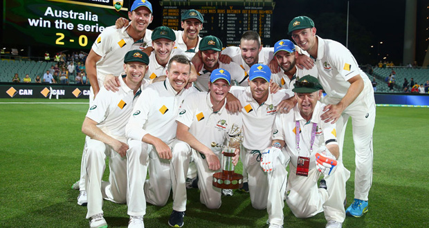 The Australian players pose with the series trophy after their victory over New Zealand in Adelaide, yesterday.