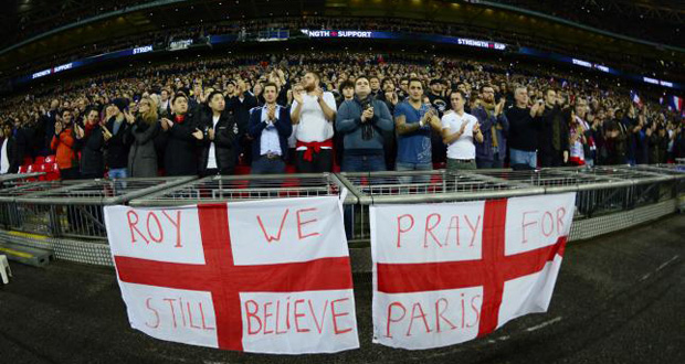 Fans in the stands display a banner before the match. Reuters / Dylan Martinez