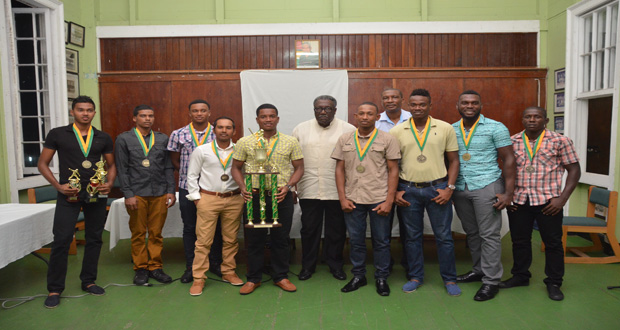 Members of the Hadi’s world two-day tournament winners GCC standing with officials of the GCA and former West Indies Captain Clive Lloyd (Delano Williams Photo)