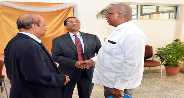 Minister of Finance Winston Jordan (right) shares a light moment with CCMF Officer-in-Charge, Dr. Dave Seerattan (centre) and Dr. Gobind Ganga, Bank of Guyana Governor