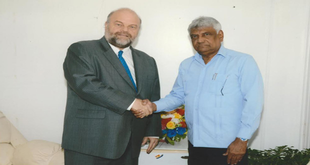 Chairman of GECOM Dr Steve Surujbally and U.S. Ambassador to Guyana Mr Perry Halloway, during their meeting Tuesday