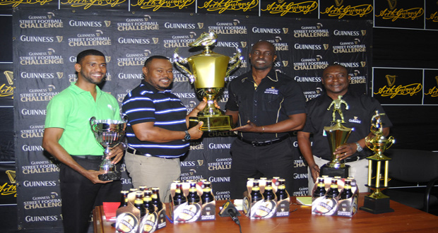 Guinness Brand Manager Lee Baptiste (2nd right) displays the Guinness Greatest of the Street Georgetown Trophy with Petra Director Troy Mendonca and they are flanked by Banks DIH PRO Troy Peters (right) and Rainforest Waters Brand Manager Errol Nelson (left).
