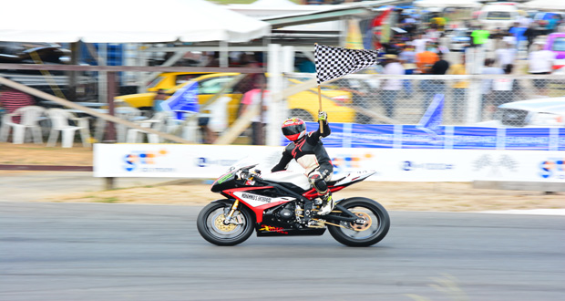 Matthew Vieira waves the chequered flag after winning one of his three Superbike races yesterday (Samuel Maughn Photos)