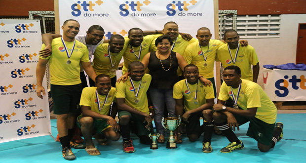 Men’s 1st Division winners of the GT&T sponsored National Indoor Hockey Championships, Pepsi Hickers, strike a pose with GT&T’s Manager of Marketing and Public Relations MS. Anjanie Hackette (centre).