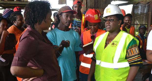 Minister within the Ministry of Social Protection, Simona Broomes, addressing GAWU representative Angela Henry in the presence of aggrieved workers