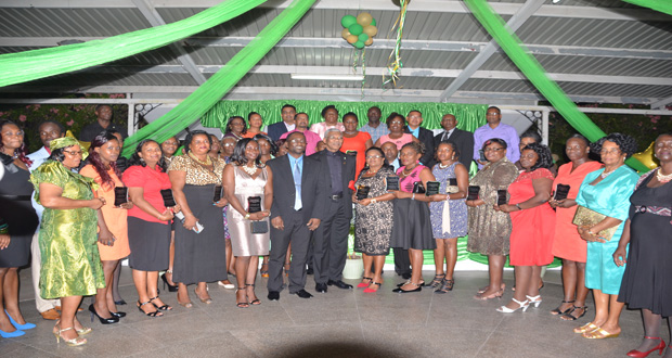 President David Granger and GTU President Mark Lyte surrounded by the awardees at the Guyana Teachers’ Union Awards ceremony at the Georgetown Club on Tuesday night